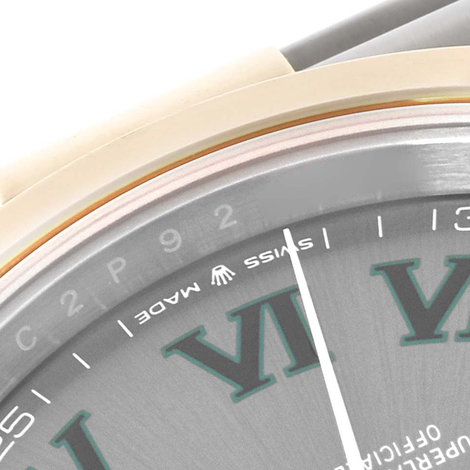 The image shows a close-up of the Rolex Datejust 41 126303 Men's Steel and Gold (two tone) Grey Dial 126303 Men's Steel and Gold (two tone) Grey Dial, highlighting the dial edge, markers, and part of the bezel.