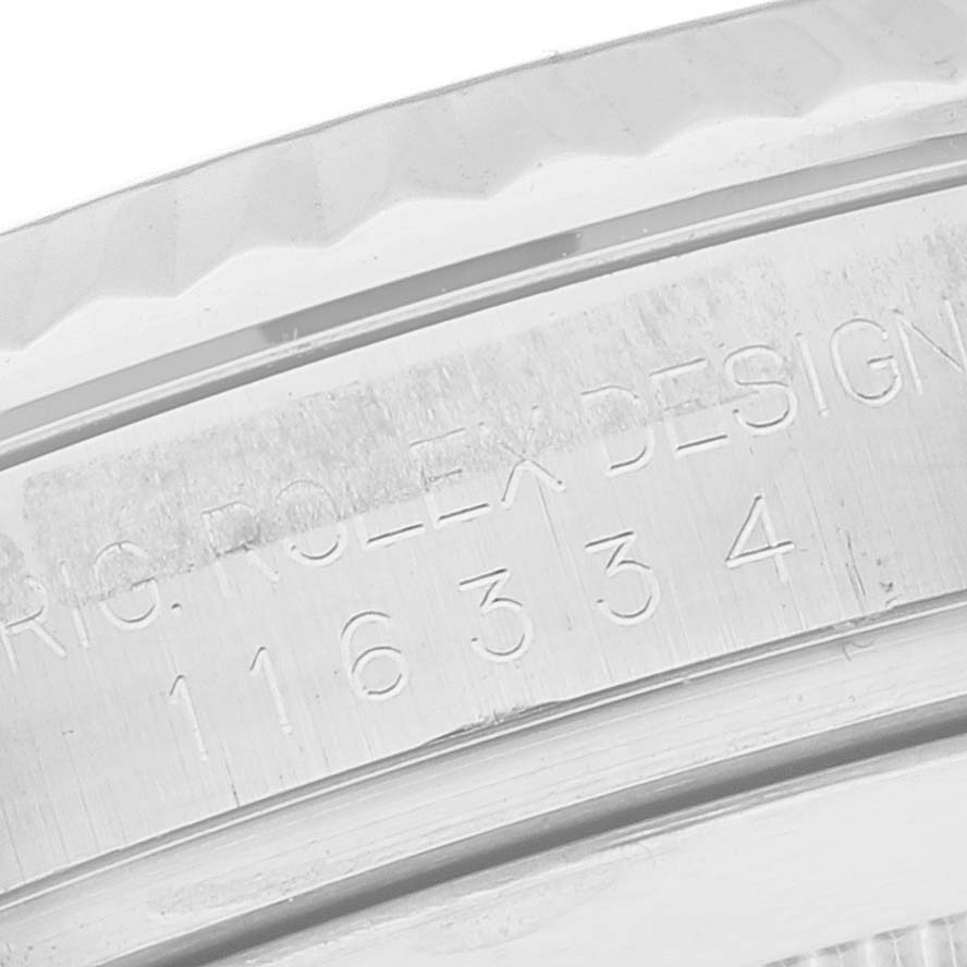 This close-up shows the engraved serial number on the inner rim of the bezel of a Rolex Datejust 41 116334 Men
s Stainless Steel Silver Dial 116334 Men
s Stainless Steel Silver Dial watch.