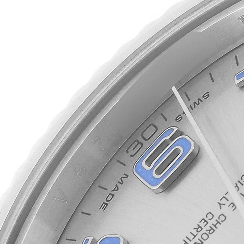 The image shows a close-up of the dial and bezel of a Rolex Datejust 41 116334 Men
s Stainless Steel Silver Dial 116334 Men
s Stainless Steel Silver Dial watch, highlighting the "Swiss Made" text and part of an Arabic numeral.