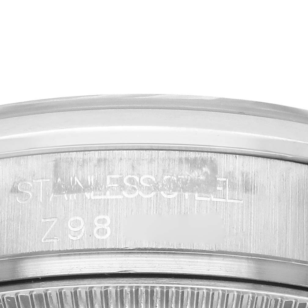 The image shows a close-up of the side and edge of a Rolex Mid-Size 178240 Women's Stainless Steel Black Dial 178240 Women's Stainless Steel Black Dial watch, highlighting the stainless steel case.