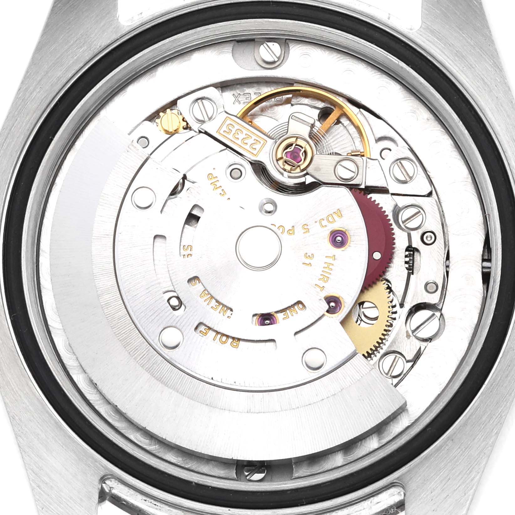 This image shows a close-up of the movement inside a Rolex Mid-Size 178274 Women's Stainless Steel Silver Dial 178274 Women's Stainless Steel Silver Dial watch, highlighting the intricate gears and components.