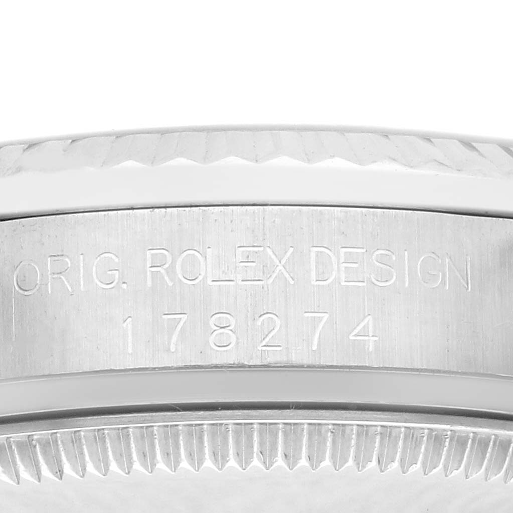 The image shows a close-up of the case side of a Rolex Mid-Size 178274 Women's Stainless Steel Silver Dial 178274 Women's Stainless Steel Silver Dial model, highlighting the engraved model number and design name.