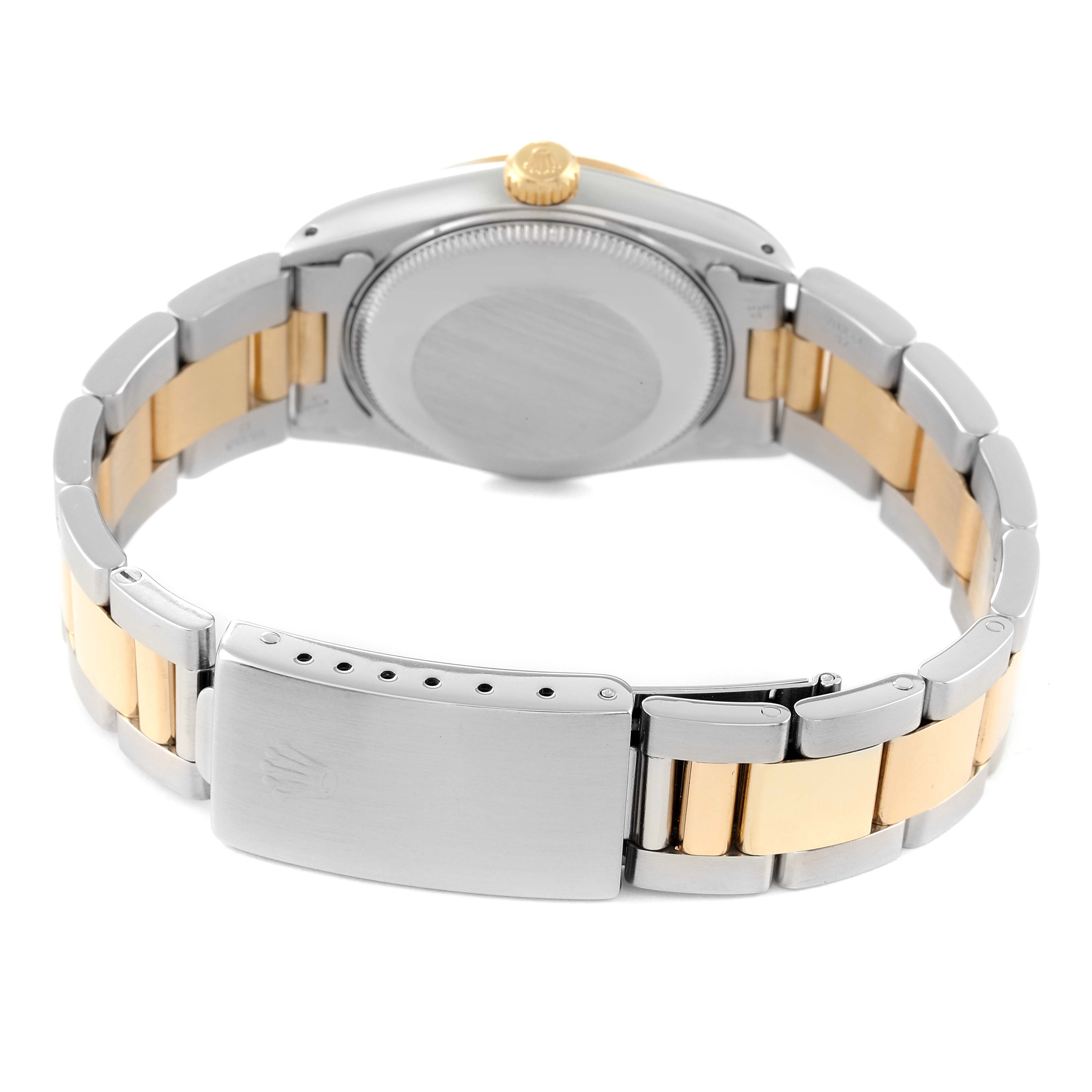 The image shows the back view of the Rolex Mid-Size 68273 Women
s Steel and Gold (two tone) Champagne Dial 68273 Women
s Steel and Gold (two tone) Champagne Dial model watch, highlighting the clasp, bracelet, crown, and case back.