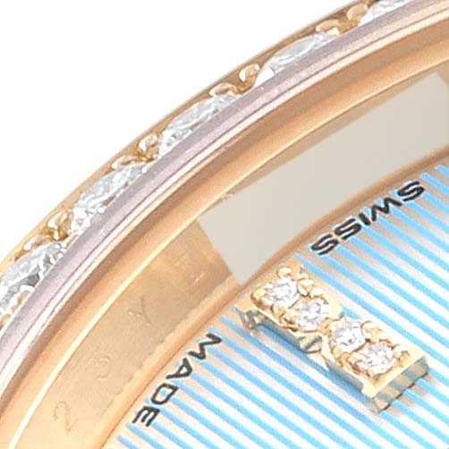 This image shows a close-up of the Rolex President 279138 Women's Yellow Gold Blue Dial 279138 Women's Yellow Gold Blue Dial model watch dial, highlighting the diamond-studded hour markers and part of the bezel.
