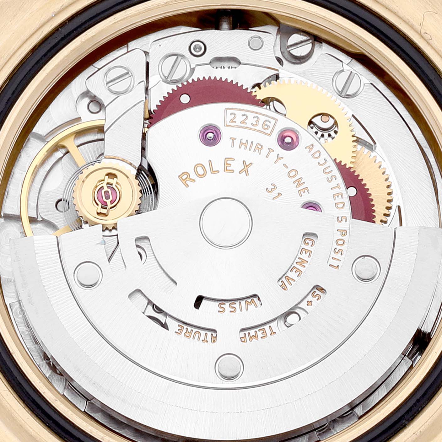 This close-up angle shows the inner mechanics of the Rolex President 279138 Women's Yellow Gold Blue Dial 279138 Women's Yellow Gold Blue Dial model watch, highlighting its intricate movement parts.