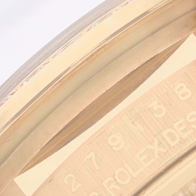 The image shows a close-up view of the bezel and part of the dial, displaying the "ROLEX" branding, on a Rolex President 279138 Women's Yellow Gold Blue Dial 279138 Women's Yellow Gold Blue Dial model watch.