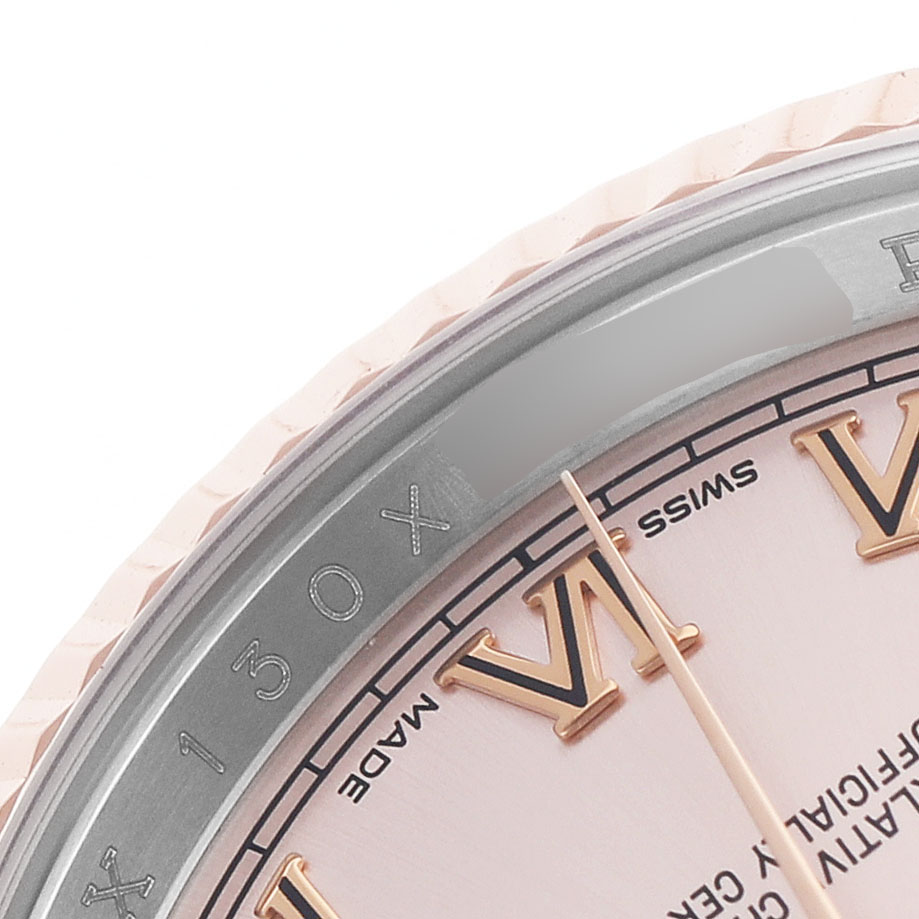 The image shows a close-up of the Rolex Datejust 116231 Men's Steel and Gold (two tone) Pink Dial's partial dial, bezel, and Roman numeral markers.