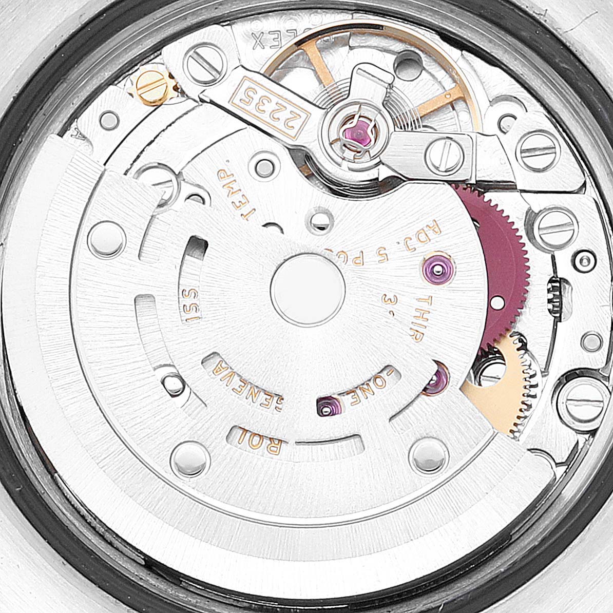 This image shows a close-up of the movement's rotor and internal mechanisms of a Rolex Datejust 179174 Women's Stainless Steel White Dial 179174 Women's Stainless Steel White Dial watch.