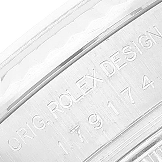 This image shows a close-up of the case side engraving of a Rolex Datejust 179174 Women's Stainless Steel White Dial 179174 Women's Stainless Steel White Dial watch.