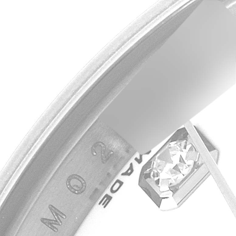 This close-up of the Rolex Datejust 179174 Women's Stainless Steel White Dial 179174 Women's Stainless Steel White Dial model shows a partial view of the dial edge, a diamond hour marker, and part of the bezel.