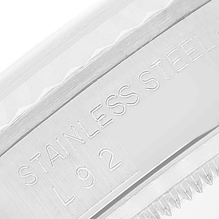 This image shows a close-up of the stainless steel bezel edge and case back of a Rolex Datejust 16234 Men's Stainless Steel Silver Dial 16234 Men's Stainless Steel Silver Dial watch.