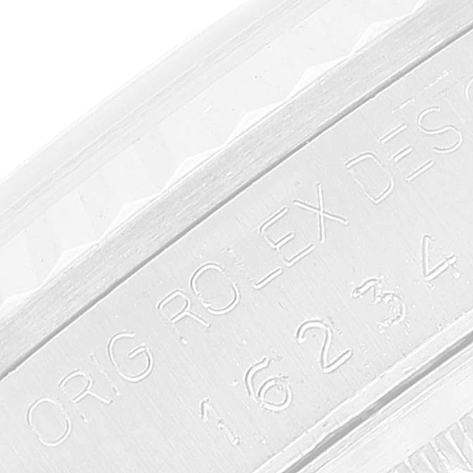 This image shows the engraving on the inner bezel of a Rolex Datejust 16234 Men's Stainless Steel Silver Dial 16234 Men's Stainless Steel Silver Dial model watch.