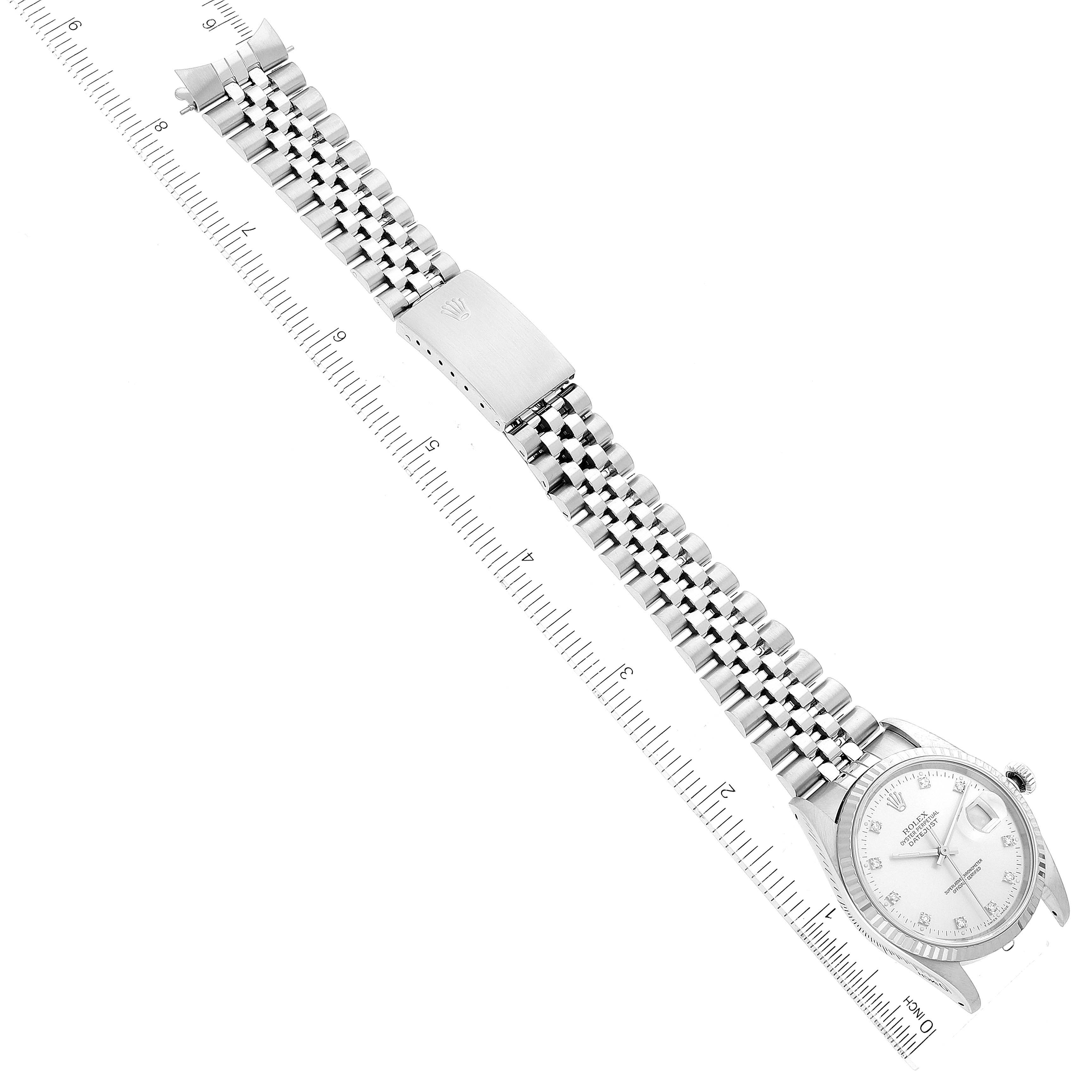 The image shows a Rolex Datejust 16234 Men's Stainless Steel Silver Dial 16234 Men's Stainless Steel Silver Dial watch laid flat against a ruler, showcasing the dial, bracelet, and clasp.