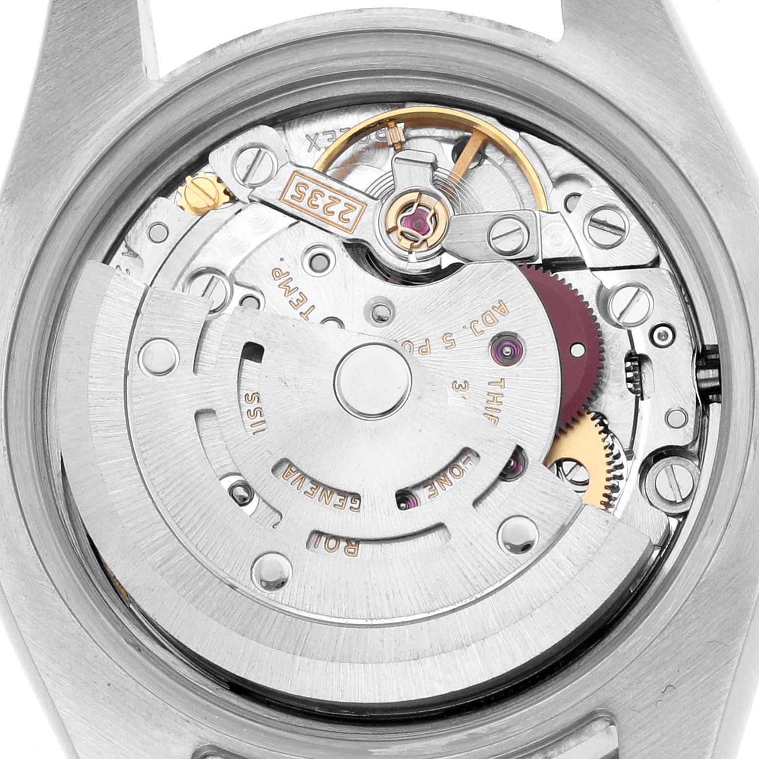 The image shows the movement mechanism of a Rolex Datejust 179174 Women's Stainless Steel Blue Dial watch from a top-down view, highlighting gears and components.