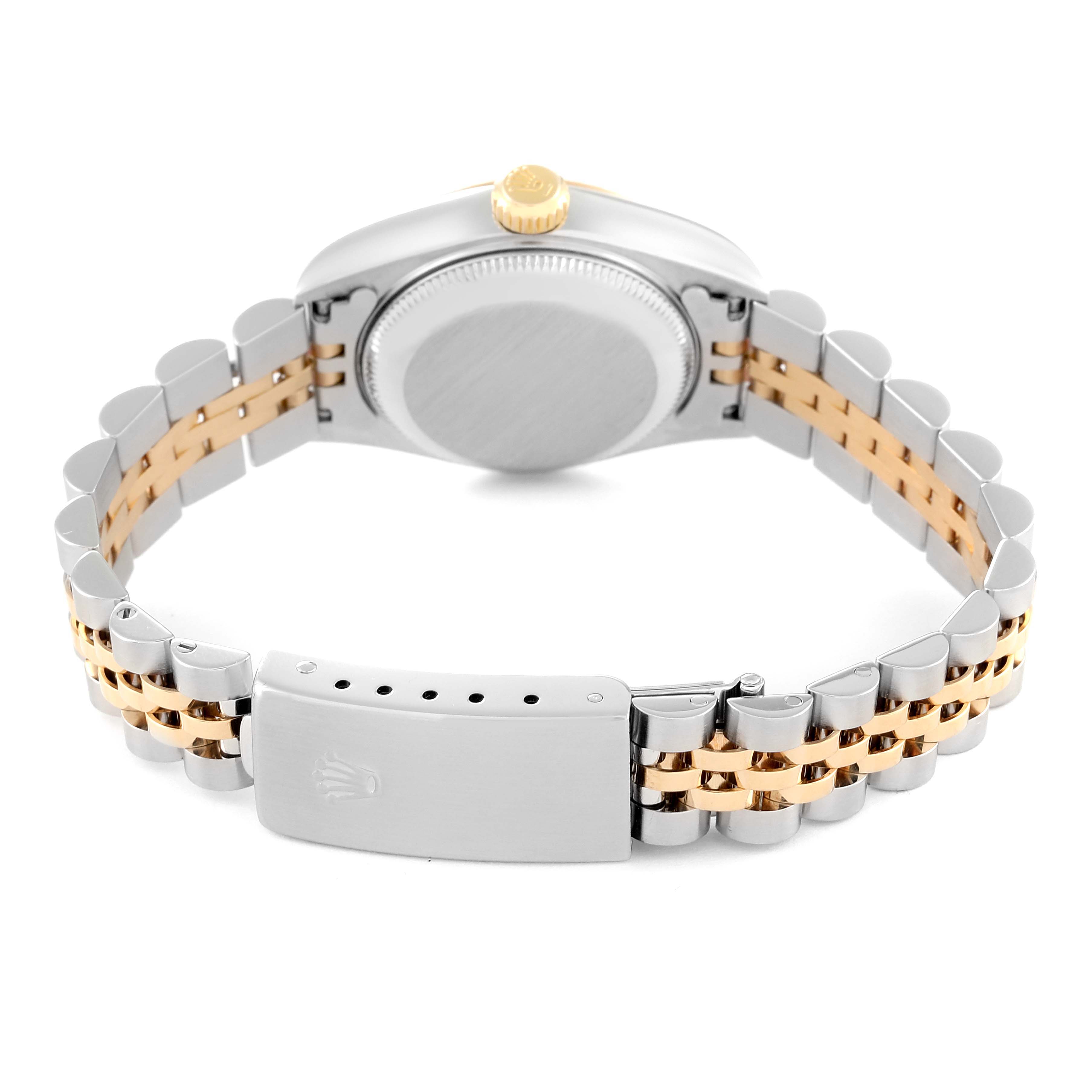 The image shows the back view of a Rolex Datejust 79173 Women's Steel and Gold (two tone) Champagne Dial 79173 Women's Steel and Gold (two tone) Champagne Dial watch, including its case back, crown, and two-tone bracelet with clasp.