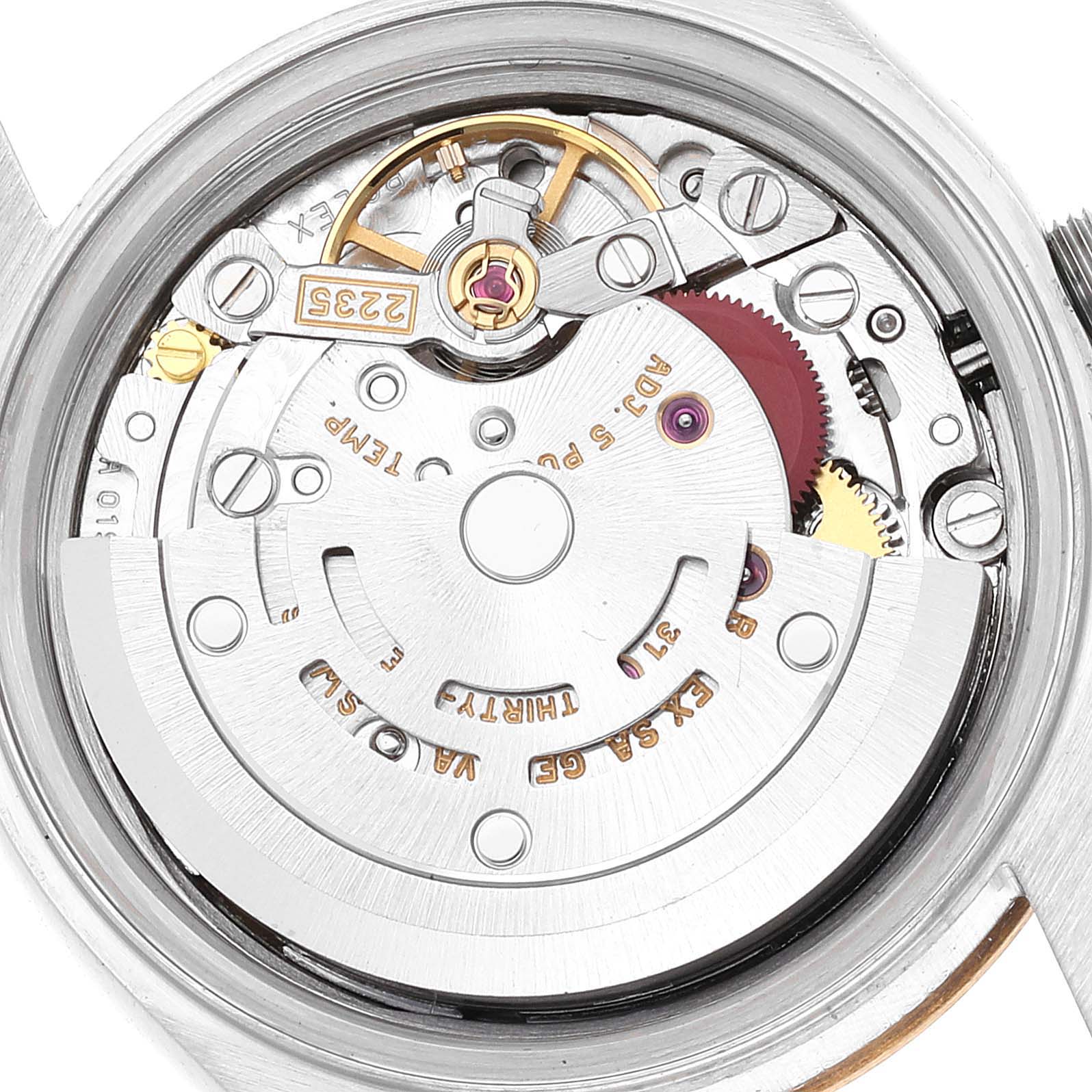 The image shows the internal mechanism of a Rolex Datejust 79173 Women's Steel and Gold (two tone) Champagne Dial 79173 Women's Steel and Gold (two tone) Champagne Dial watch, highlighting gears and intricate components from a top-down angle.