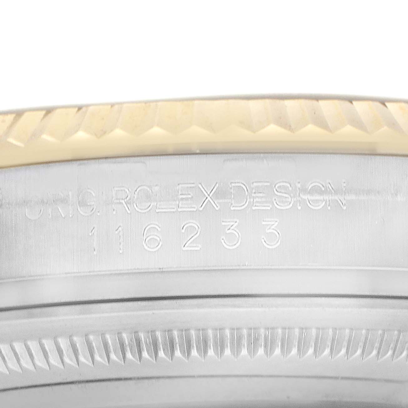 This image shows a close-up of the Rolex Datejust 116233 Men
s Steel and Gold (two tone) Champagne Dial bezel and case side, highlighting engravings.