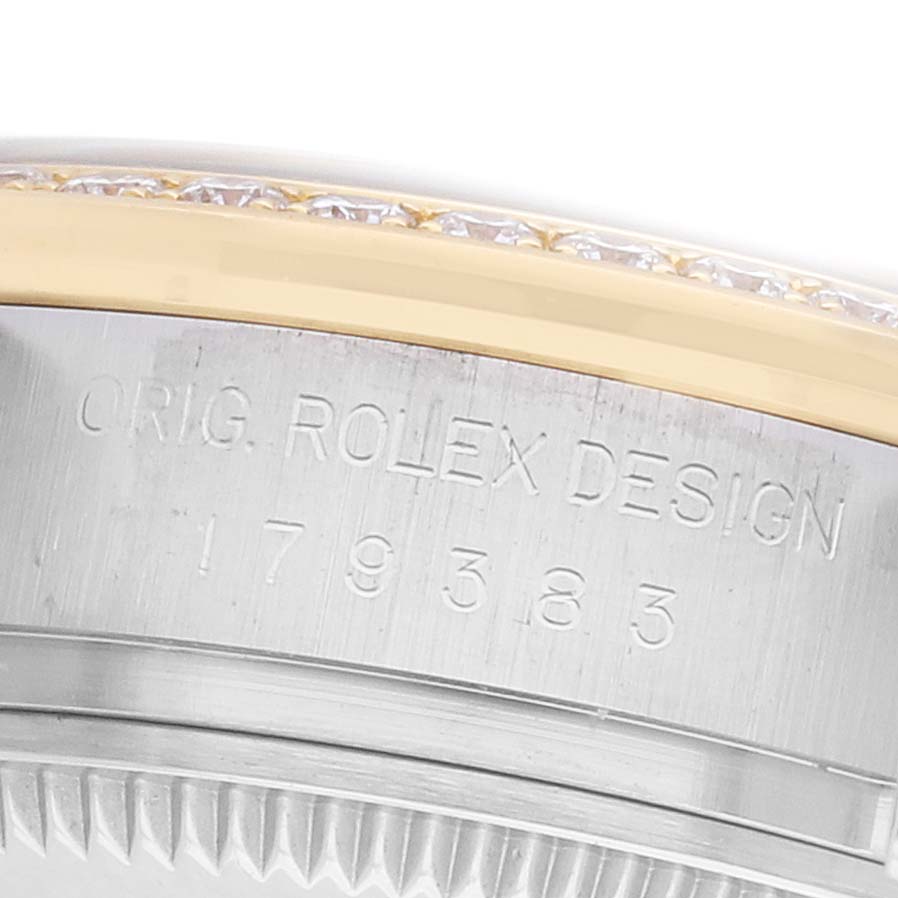 The image shows a close-up of the side of a Rolex Datejust 179383 Women's Steel and Gold (two tone) Mother of Pearl Dial, highlighting the engraved model number and design details on the case.
