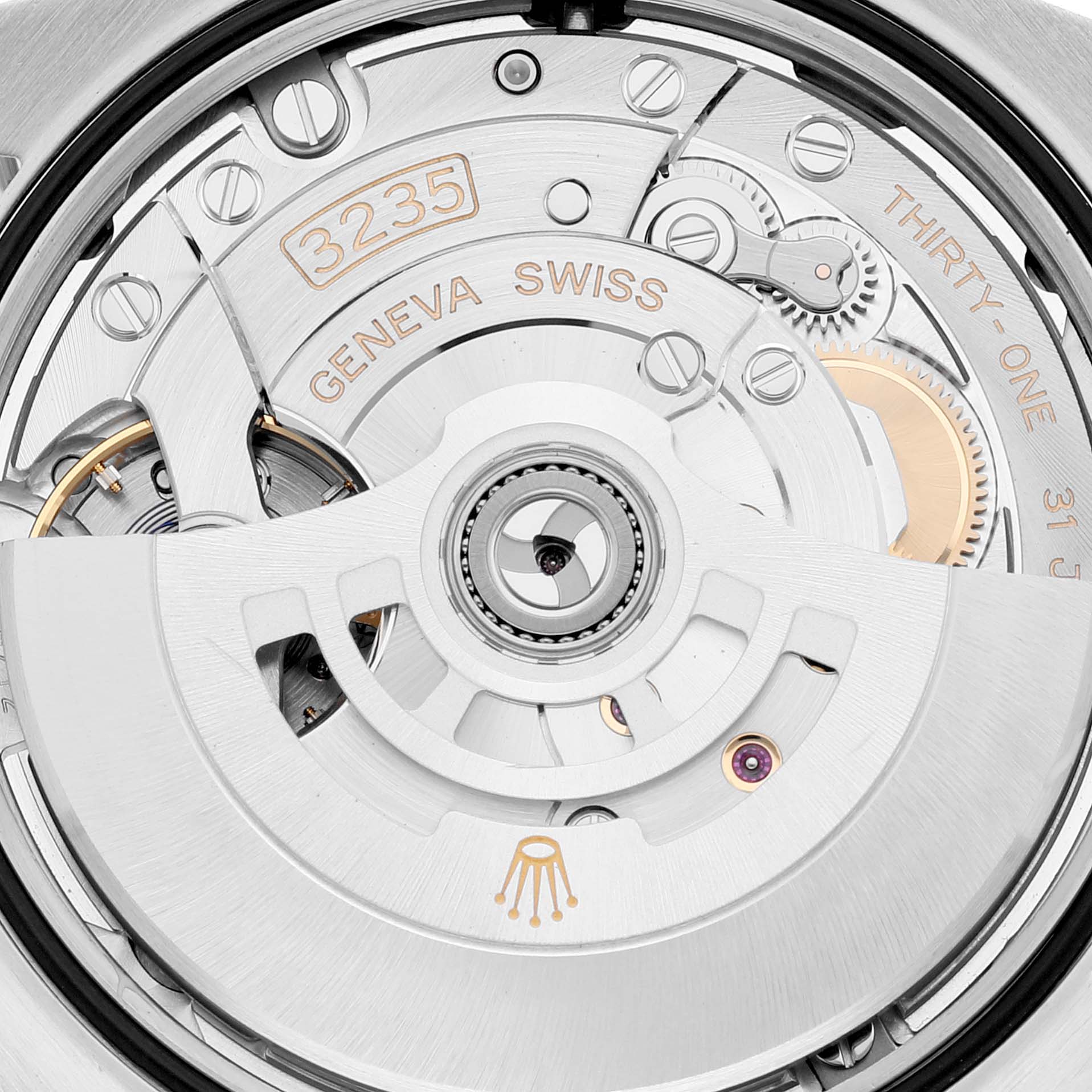 This is a close-up of the Rolex Datejust 126233 Men's Steel and Gold (two tone) White Dial 126233 Men's Steel and Gold (two tone) White Dial watch's movement, showing intricate parts and engravings.