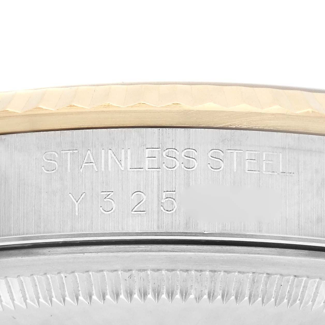 The image shows a close-up of the side engraving on a Rolex Datejust 16233 Men
s Steel and Gold (two tone) White Dial 16233 Men
s Steel and Gold (two tone) White Dial watch case, highlighting the stainless steel part.
