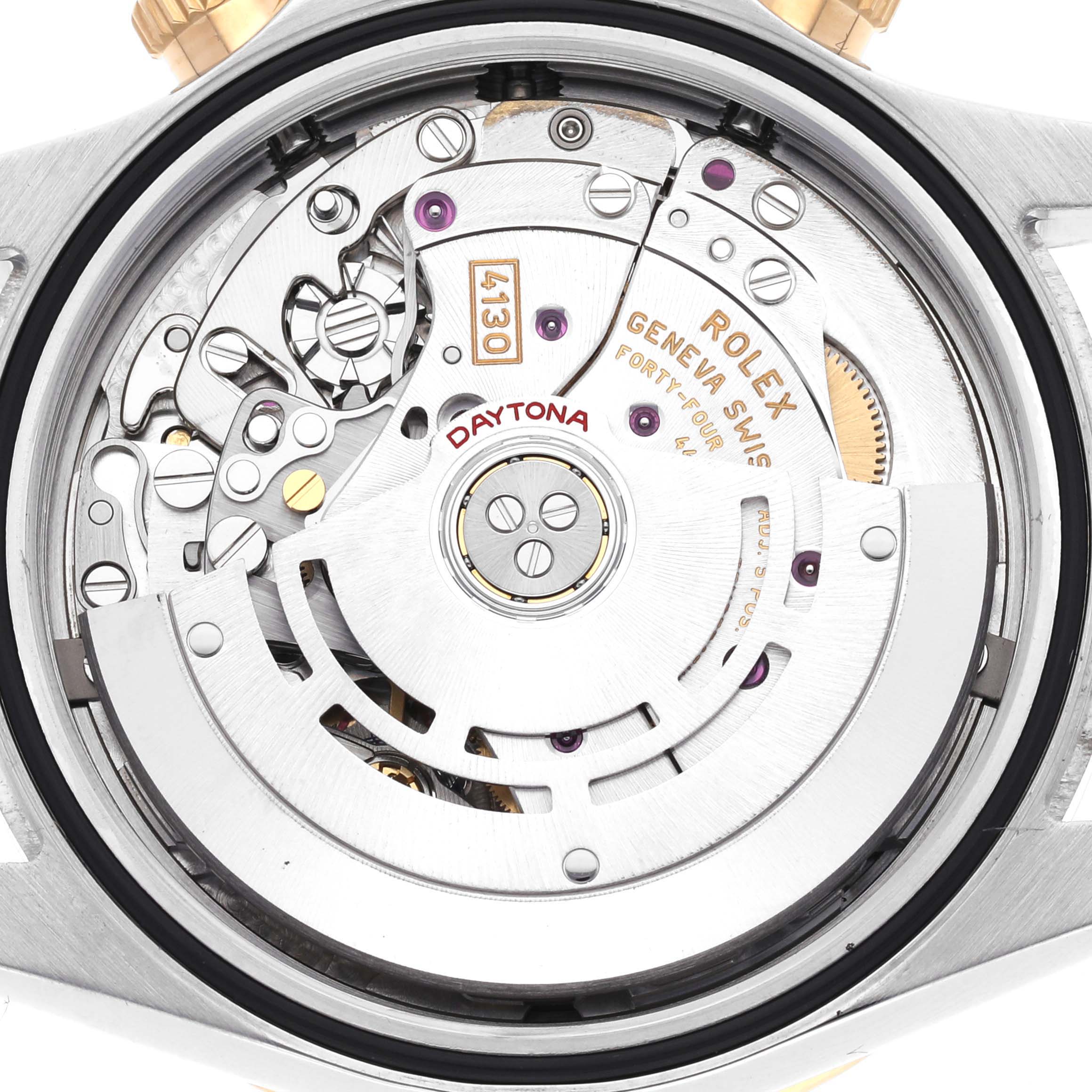 The image shows the Rolex Daytona 116503 Men
s Steel and Gold (two tone) Champagne Dial 116503 Men
s Steel and Gold (two tone) Champagne Dial
s internal watch movement from a rear angle, highlighting its intricate components.