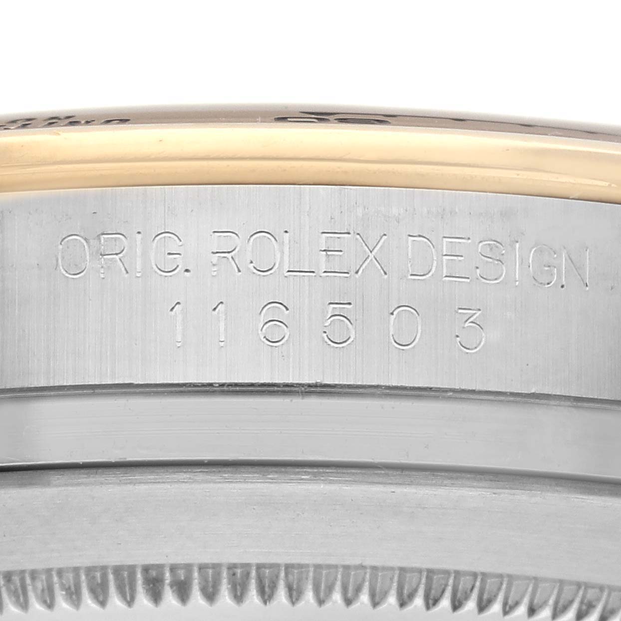 The image shows the side of the Rolex Daytona 116503 Men
s Steel and Gold (two tone) Champagne Dial 116503 Men
s Steel and Gold (two tone) Champagne Dial watch casing, featuring the model number "116503" engraved.