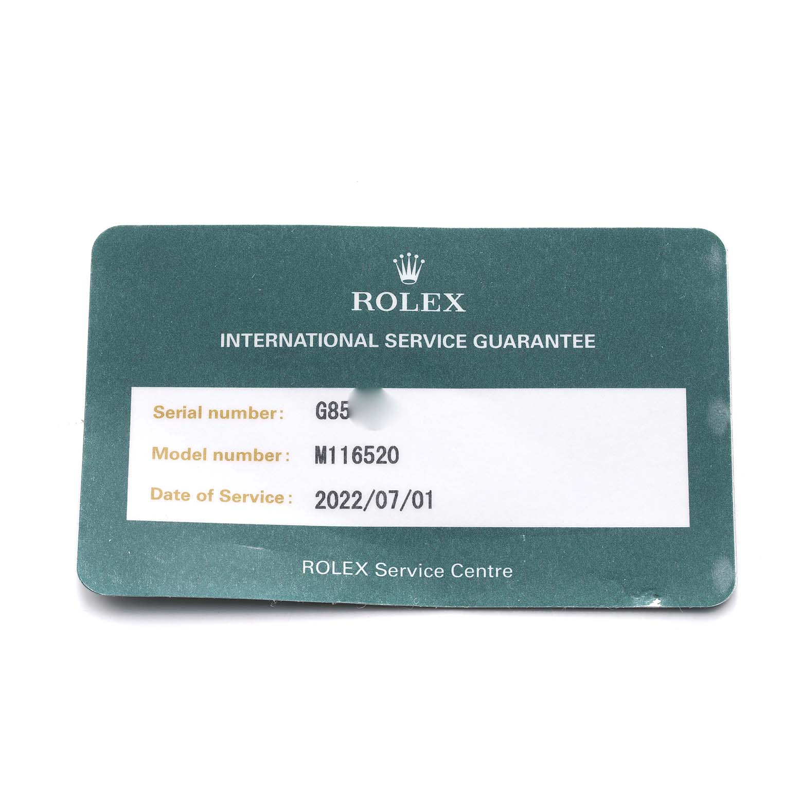 The image shows a Rolex International Service Guarantee card for the Daytona model, indicating service details and serial information.
