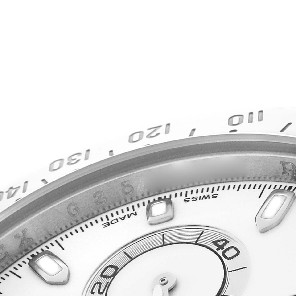 The image shows a partial close-up of the Rolex Daytona 116520 Men
s Stainless Steel White Dial watch, focusing on the bezel, dial, and sub-dial.