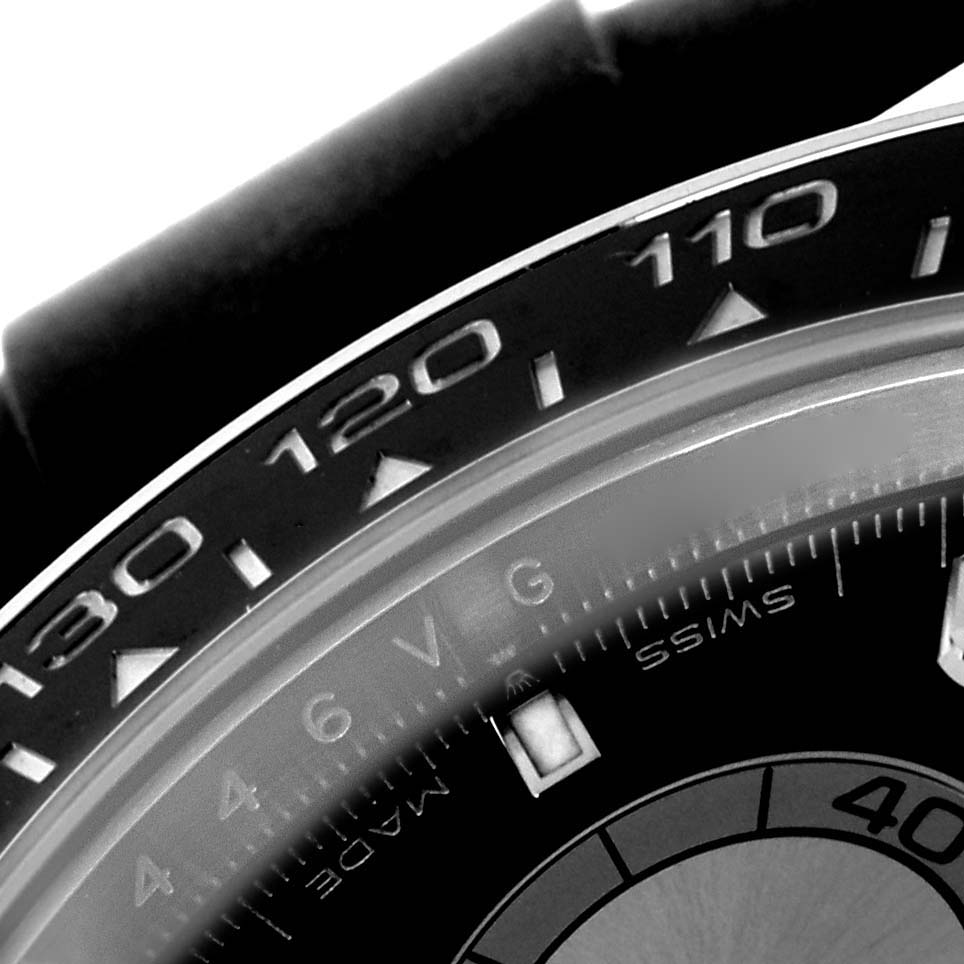 The image shows the bezel and part of the dial of a Rolex Daytona 126519 Men's White Gold Black Dial 126519 Men's White Gold Black Dial, highlighting the tachymetric scale.