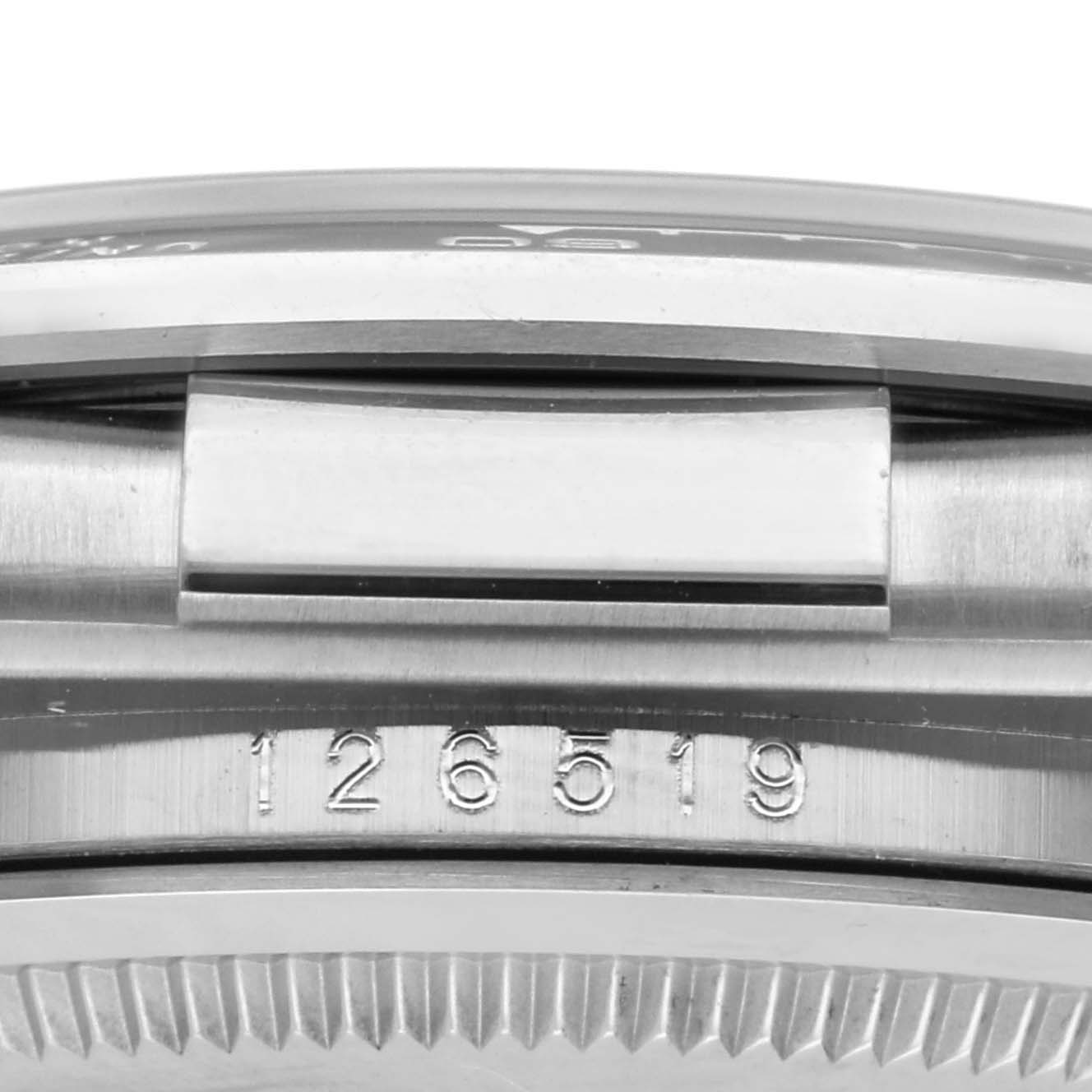 The image shows a side view of the Rolex Daytona 126519 Men's White Gold Black Dial 126519 Men's White Gold Black Dial watch, focusing on the case edge and model number engraving.