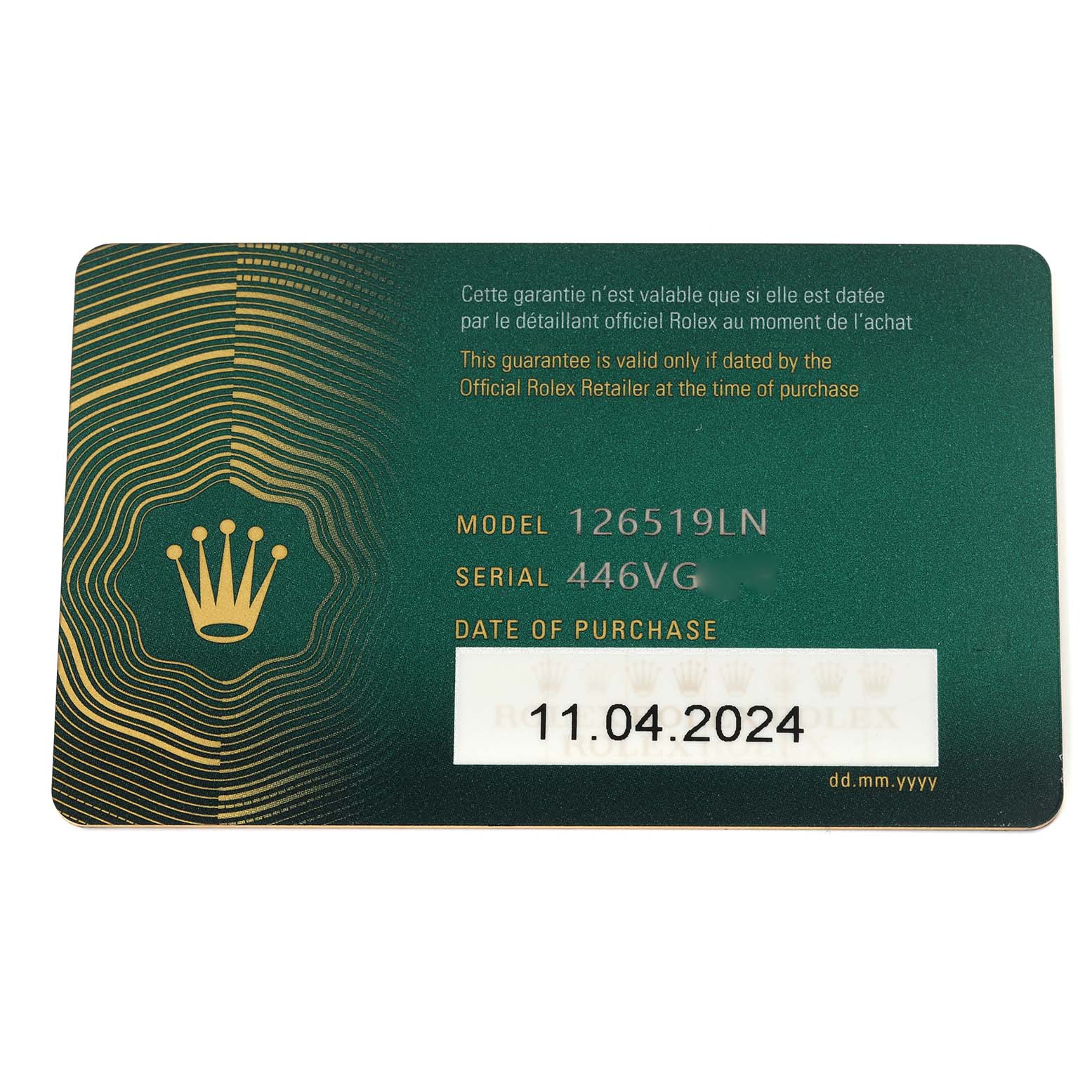 This image shows a Rolex Daytona 126519 Men's White Gold Black Dial 126519 Men's White Gold Black Dial guarantee card with model and serial numbers and the date of purchase.