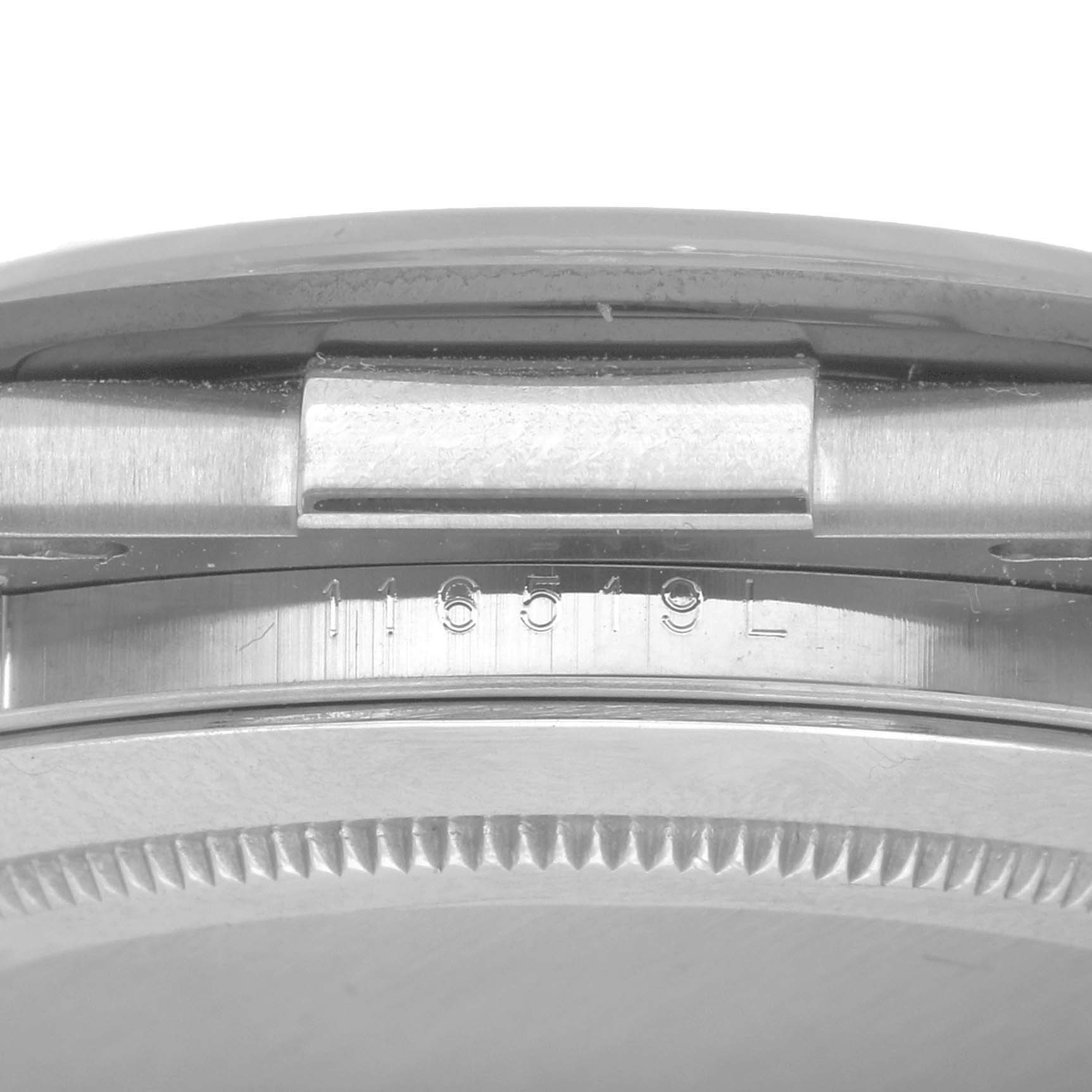 The image shows the model number engraving on the side of the Rolex Daytona 116519 Men
s White Gold Black Dial watch case.