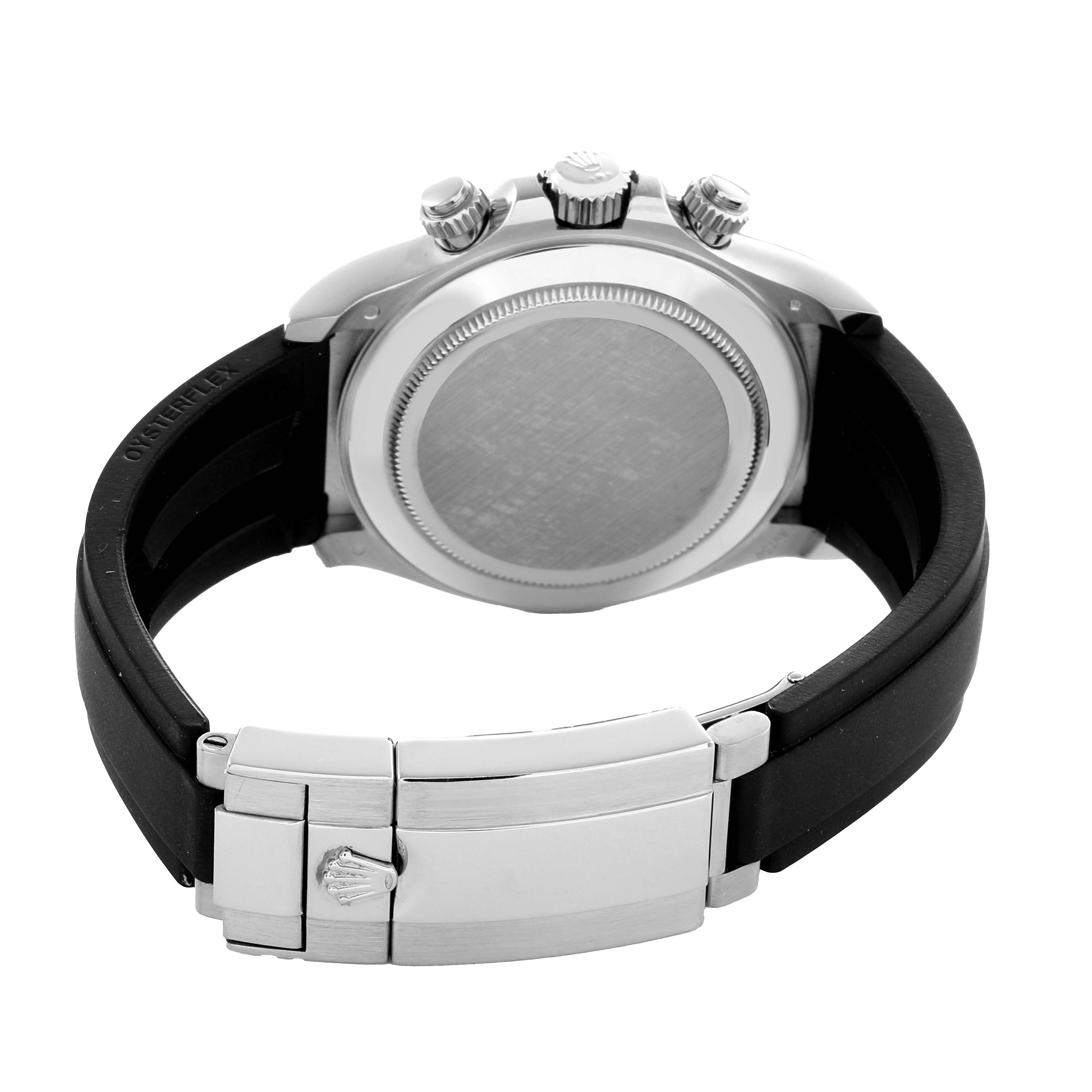 The Rolex Daytona 116519 Men
s White Gold Black Dial watch is shown from the back, highlighting the case back, crown, pushers, and rubber strap with a metal clasp.