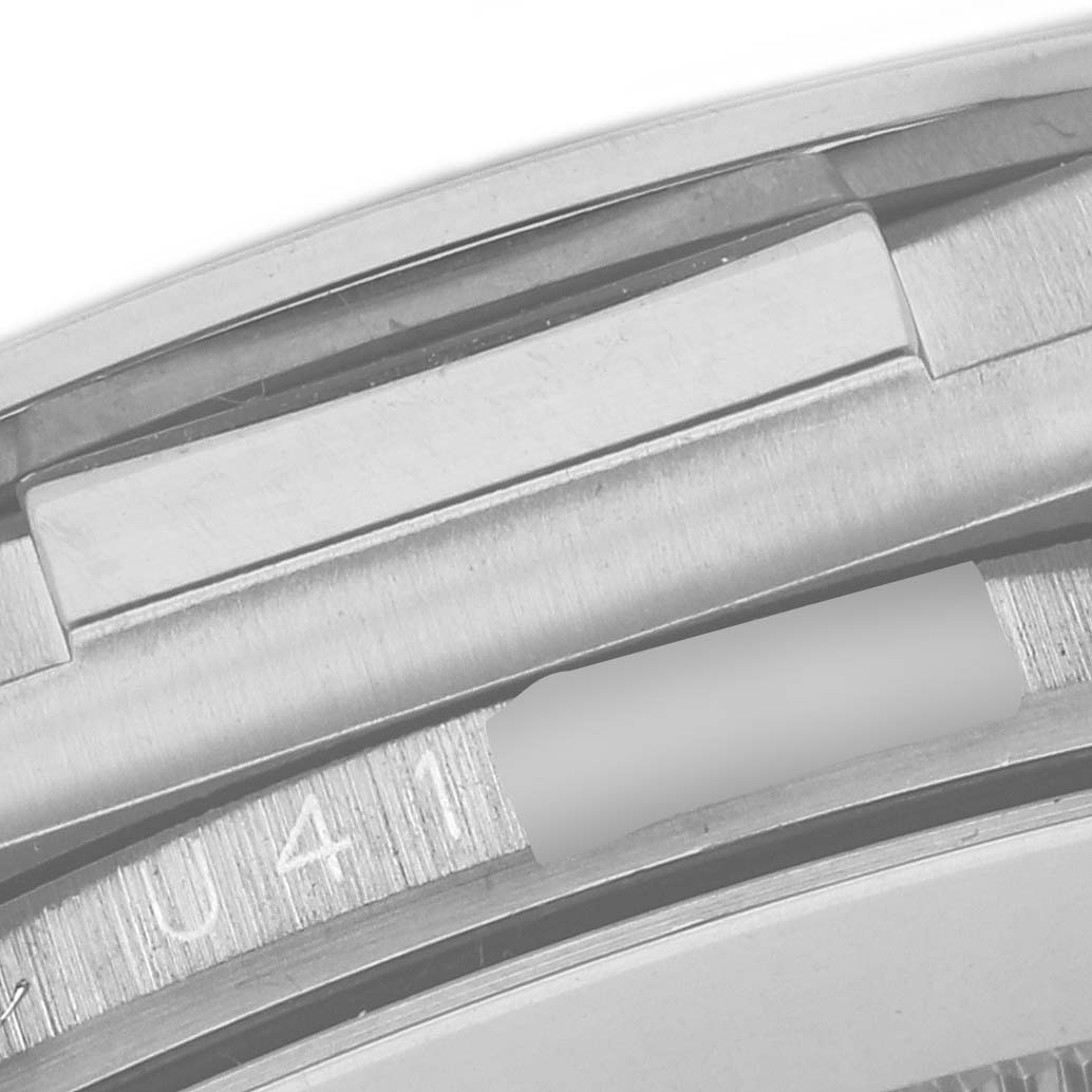 The image shows a close-up of the Rolex Daytona 16519NG Men's White Gold Mother of Pearl Dial 16519NG Men's White Gold Mother of Pearl Dial model's case, highlighting the watch's serial number area.