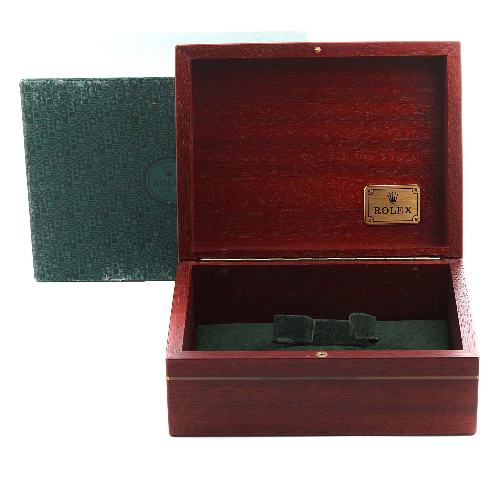 The image shows an open wooden Rolex box for the Daytona model, with a green interior and a labeled plaque.