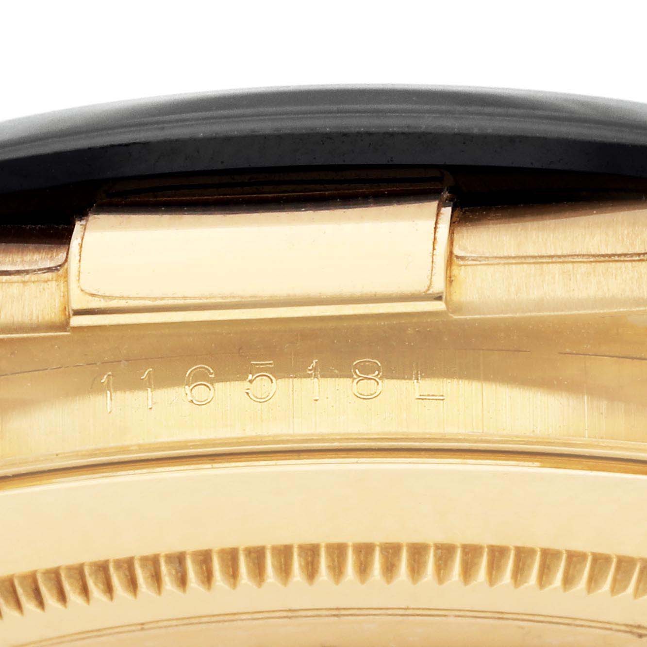 The image shows a close-up of the side of the case of a Rolex Daytona 116518 Men
s Yellow Gold Beige Dial, highlighting the model number and edge details.