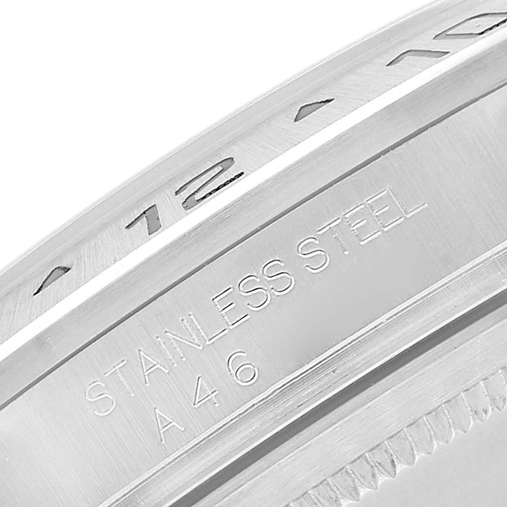 The image shows a close-up of the bezel and casing edge of a Rolex Explorer 16570 Men
s Stainless Steel Black Dial 16570 Men
s Stainless Steel Black Dial model watch, highlighting the "STAINLESS STEEL" engraving.