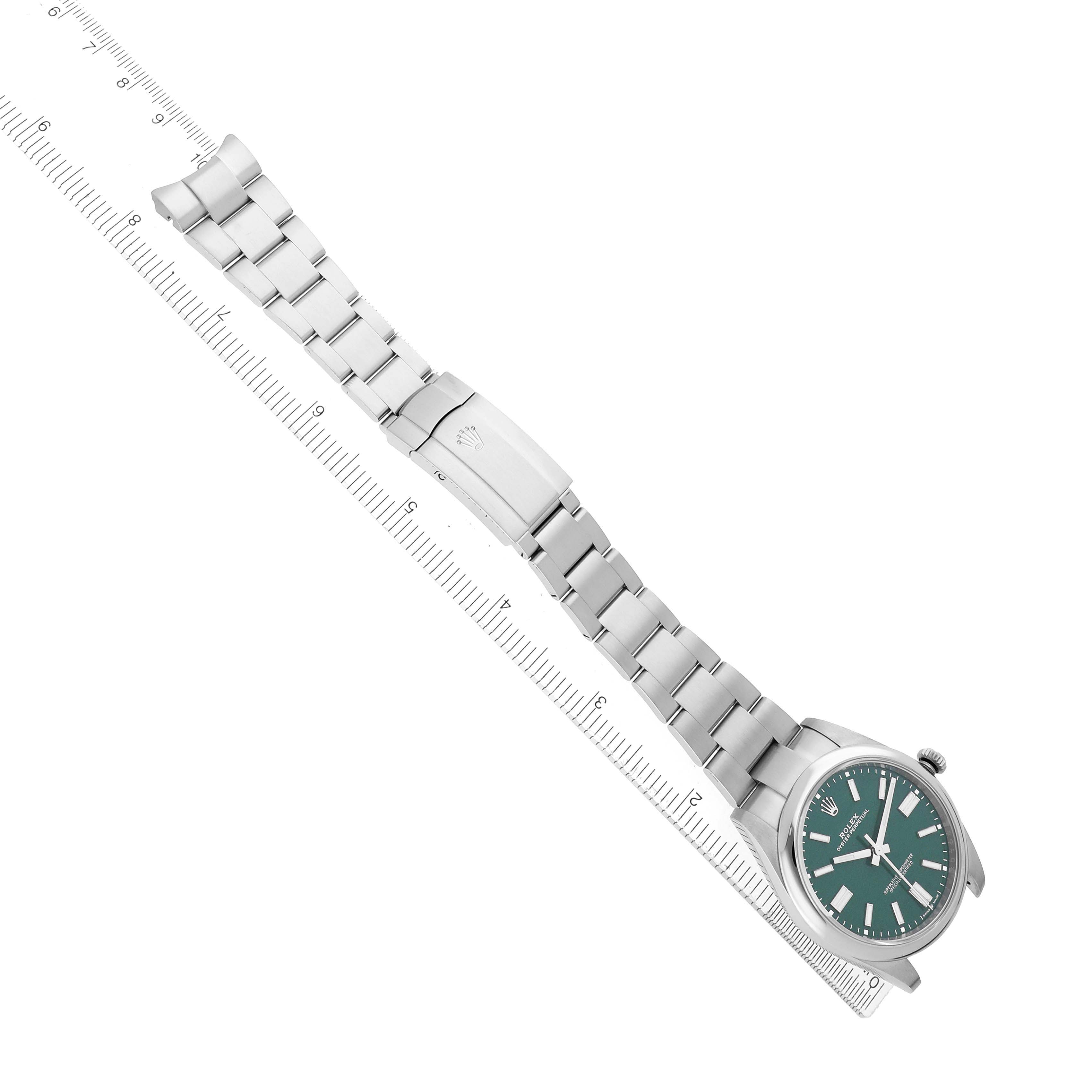 The Rolex Oyster Perpetual 124300 Men
s Stainless Steel Green Dial watch is shown from an angled top view, highlighting the bracelet, clasp, and face.