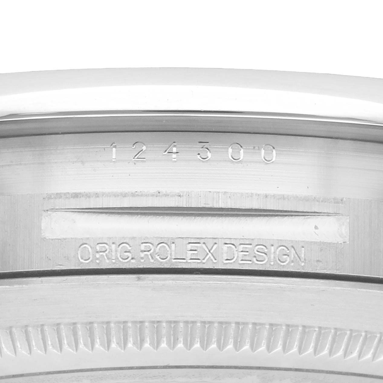 The image shows a close-up of the side of the Rolex Oyster Perpetual 124300 Men
s Stainless Steel Green Dial watch, highlighting the model number and the "ORIG. ROLEX DESIGN" engraving.