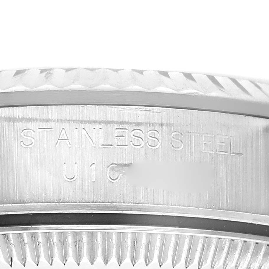 The image shows the side engraving on the case back of a Rolex Oyster Perpetual 67194 Women's Stainless Steel Black Dial 67194 Women's Stainless Steel Black Dial watch, highlighting the "Stainless Steel" text.