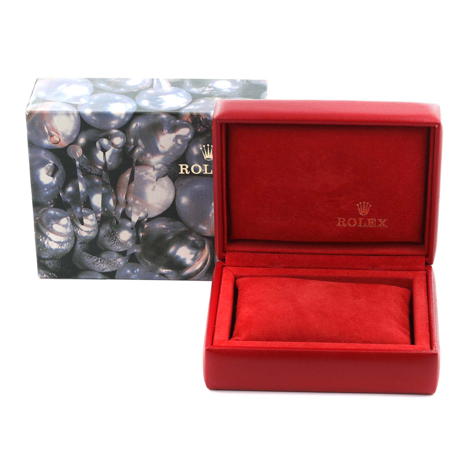 The image shows a Rolex Oyster Perpetual 67194 Women's Stainless Steel Black Dial 67194 Women's Stainless Steel Black Dial watch box, open with a red interior, alongside its outer packaging.