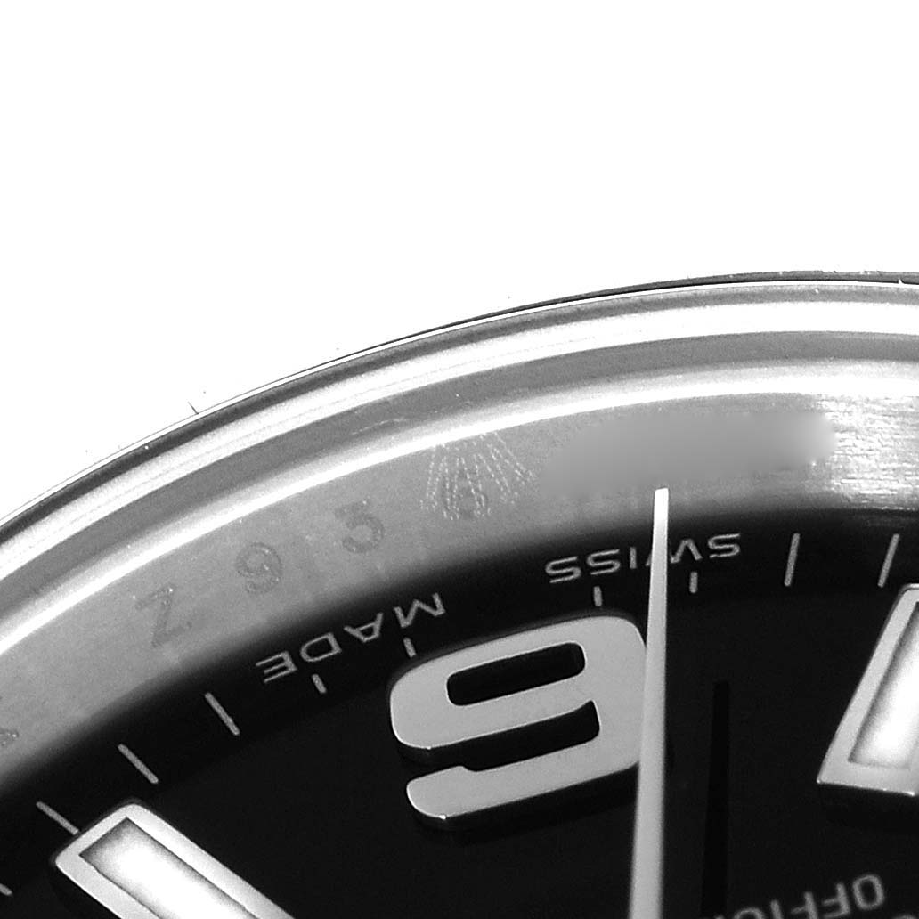 The image shows a close-up of the dial and part of the bezel of a Rolex Oyster Perpetual 176200 Women's Stainless Steel Black Dial 176200 Women's Stainless Steel Black Dial watch, highlighting the 9 o'clock hour marker.