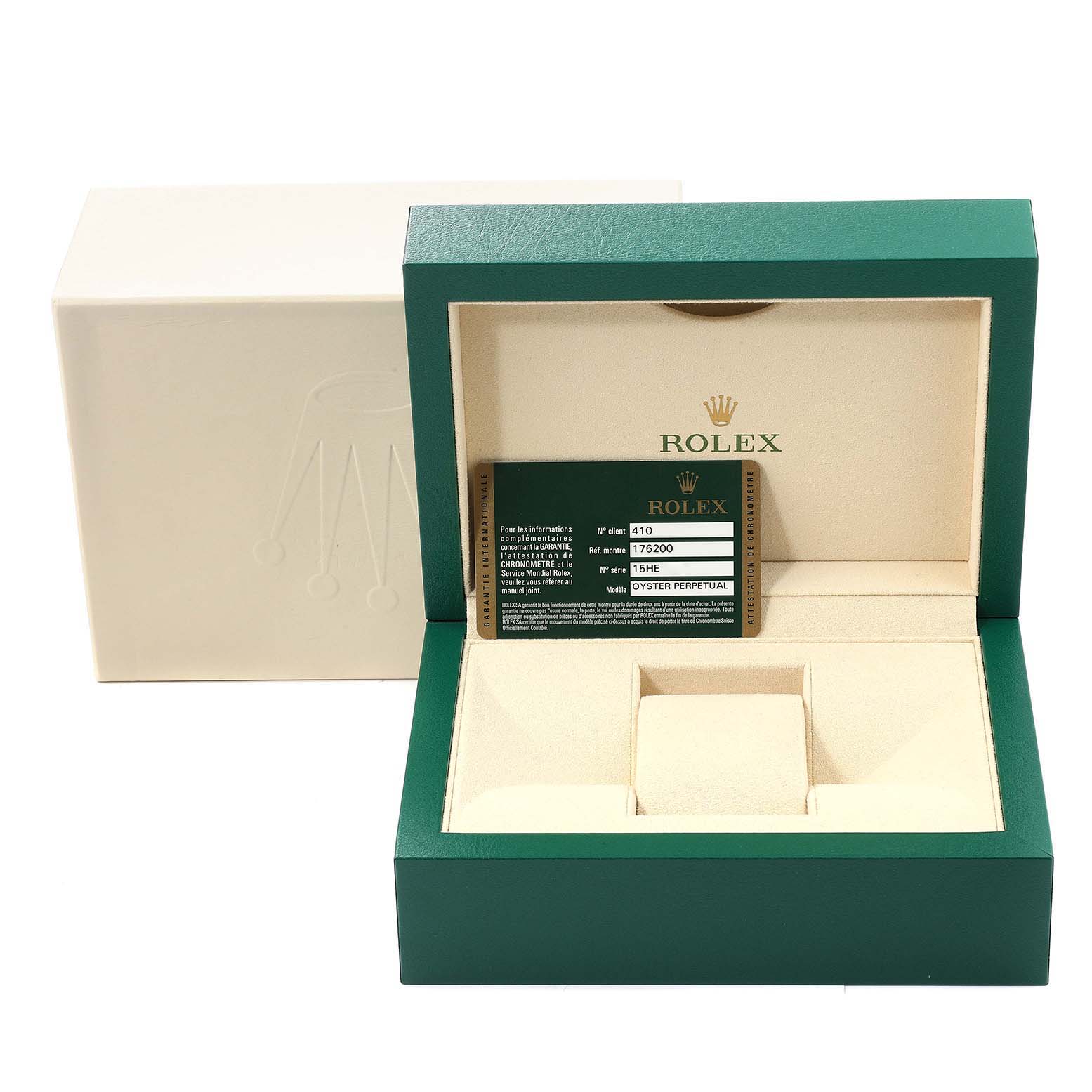 The image shows a Rolex box for the Oyster Perpetual model, including the warranty card, viewed from the front with the box open.