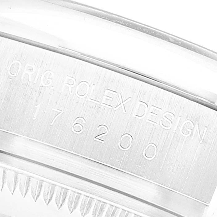 This image shows a close-up of the case back edge of a Rolex Oyster Perpetual 176200 Women's Stainless Steel Silver Dial 176200 Women's Stainless Steel Silver Dial watch, revealing the engraved model number.