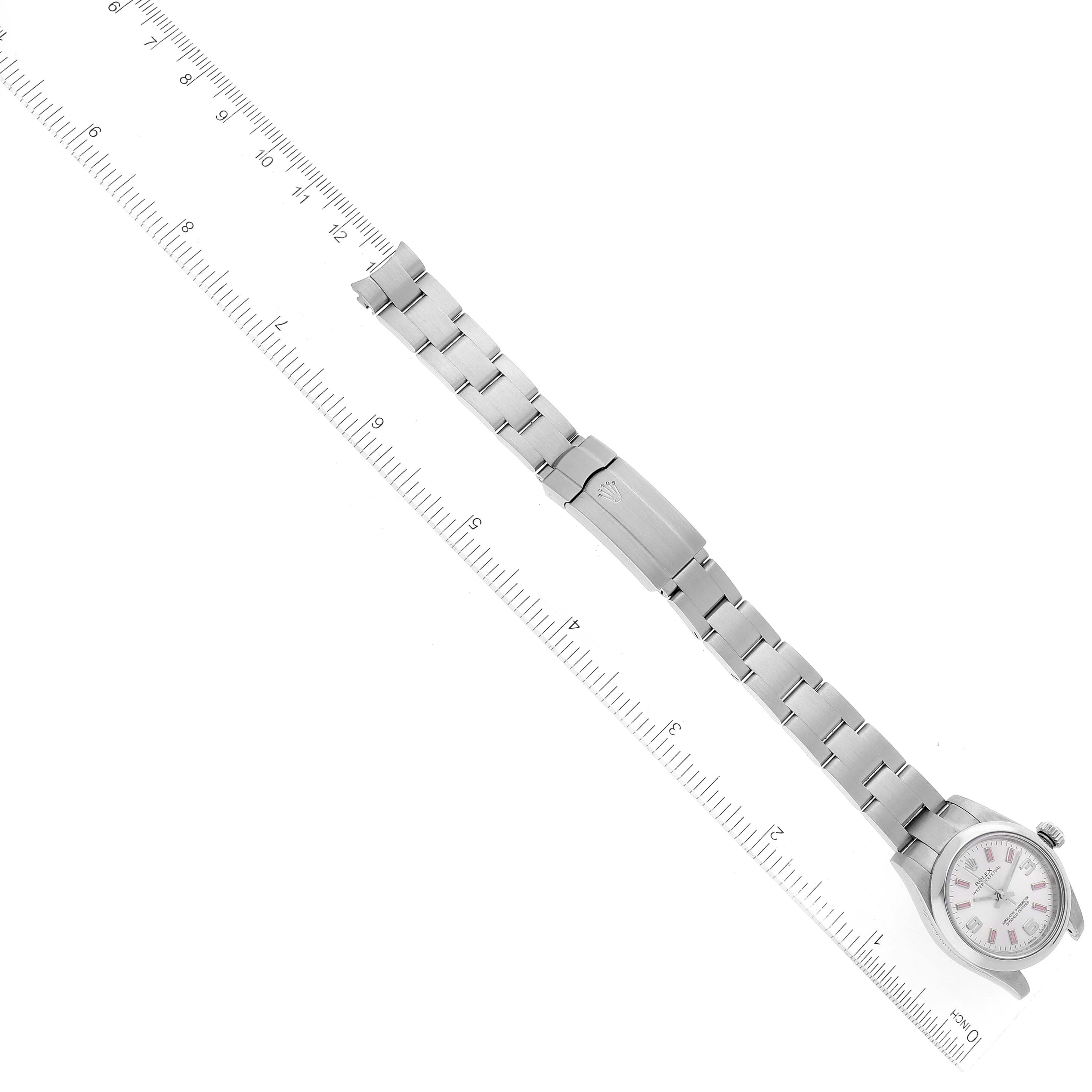 The image shows a Rolex Oyster Perpetual 176200 Women's Stainless Steel Silver Dial 176200 Women's Stainless Steel Silver Dial watch laid flat alongside a ruler, displaying the entire bracelet and case.
