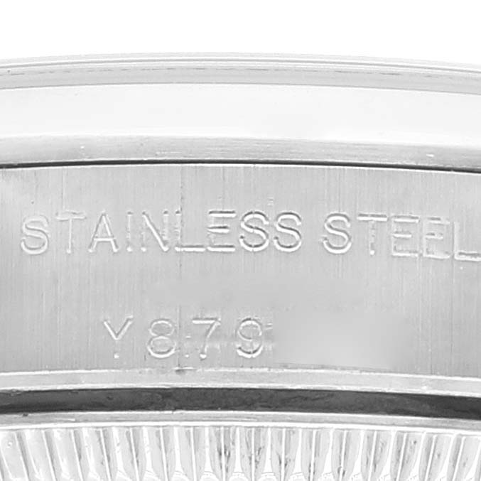 This image shows a close-up of the case back and bezel of a Rolex Oyster Perpetual 76080 Women
s Stainless Steel Pink Dial 76080 Women
s Stainless Steel Pink Dial watch, highlighting the stainless steel inscription.