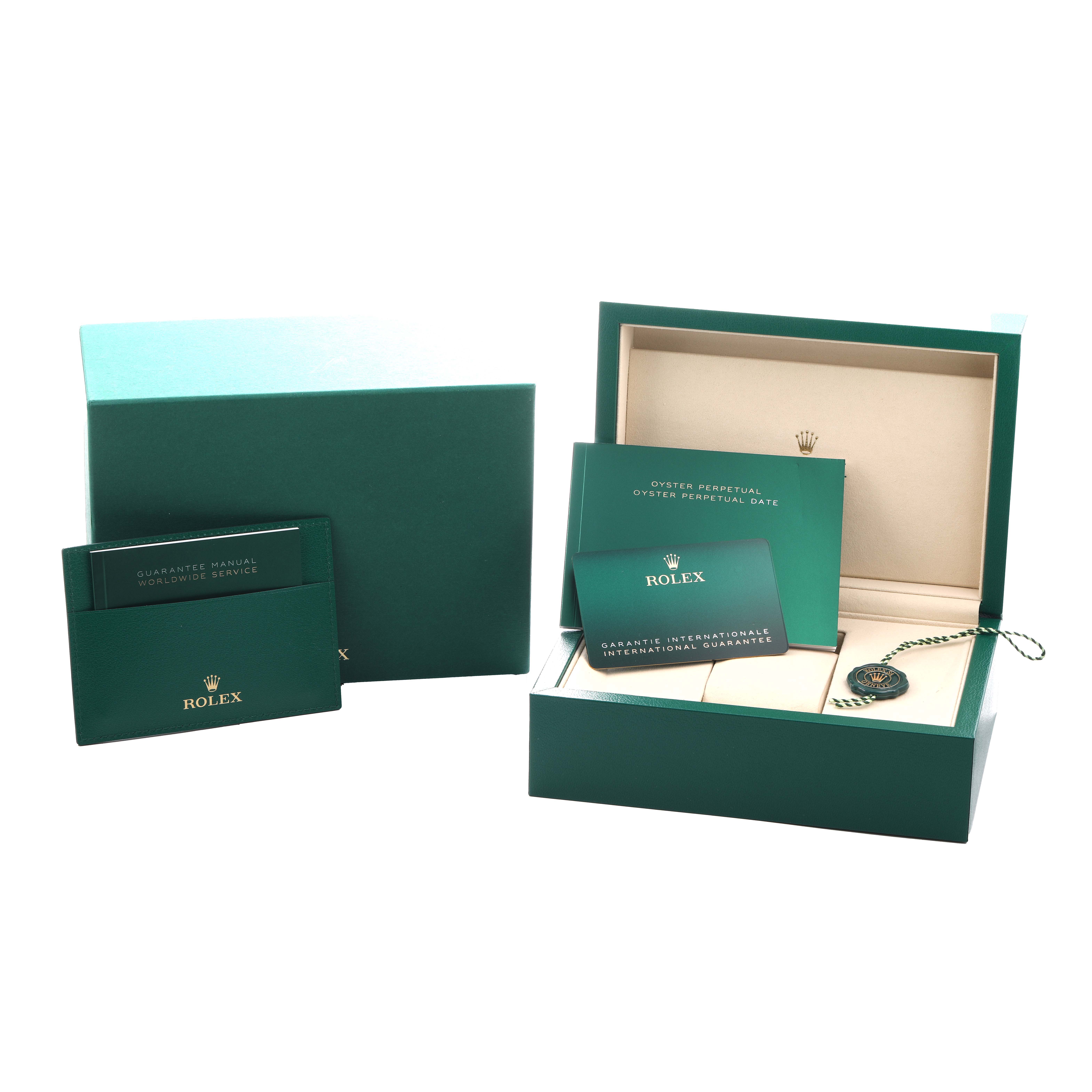 The image shows the packaging and documentation for a Rolex Oyster Perpetual 276200 Women
s Stainless Steel Green Dial, including the box, manuals, and guarantee card.