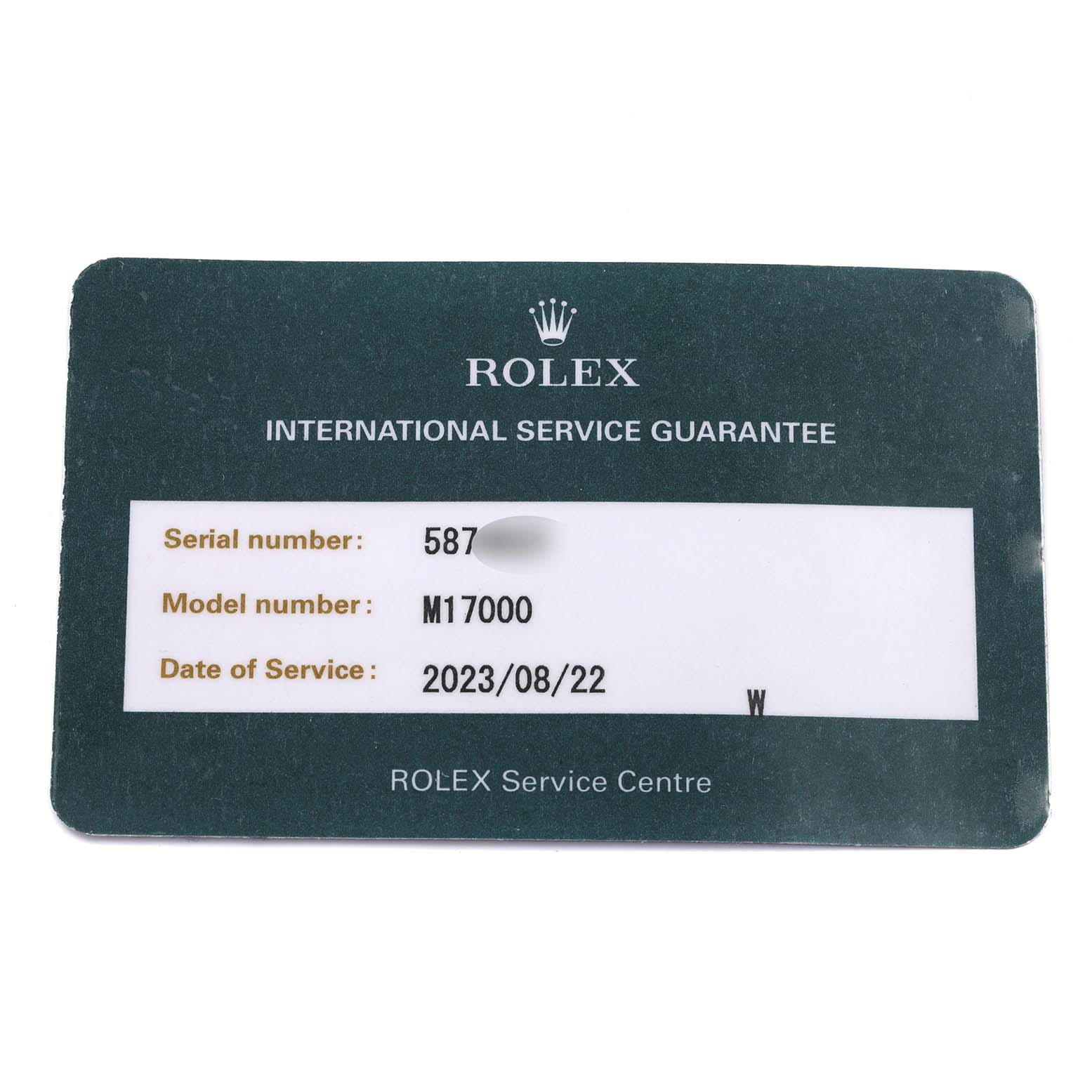 The image shows a Rolex Oysterquartz 17000 Men's Stainless Steel Black Dial 17000 Men's Stainless Steel Black Dial service guarantee card at an overhead angle.