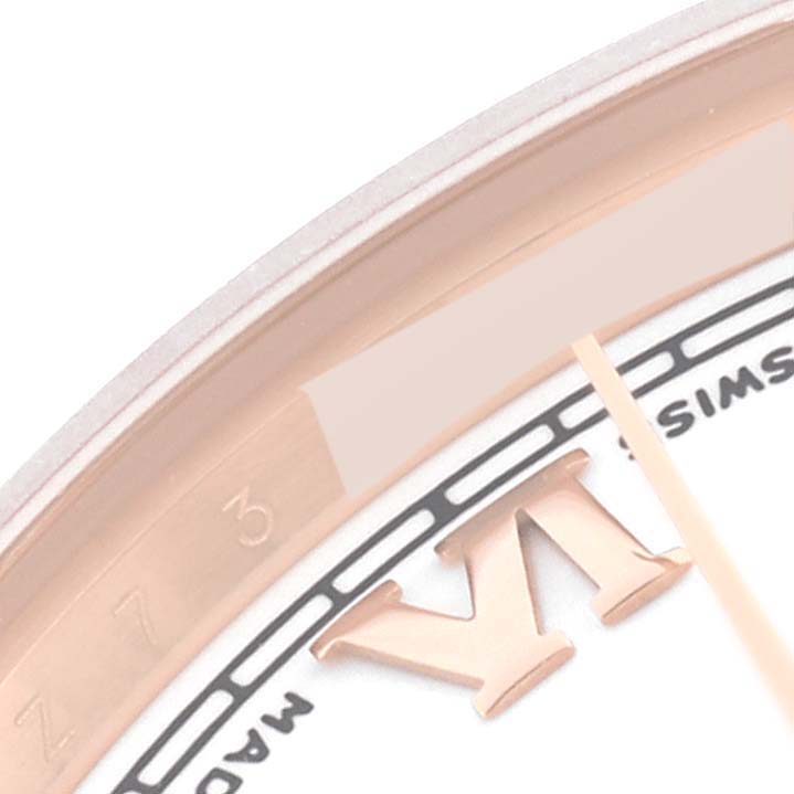 This image shows a close-up of the dial and Roman numeral VI of a Rolex President 178275 Women's Rose Gold White Dial 178275 Women's Rose Gold White Dial model watch.