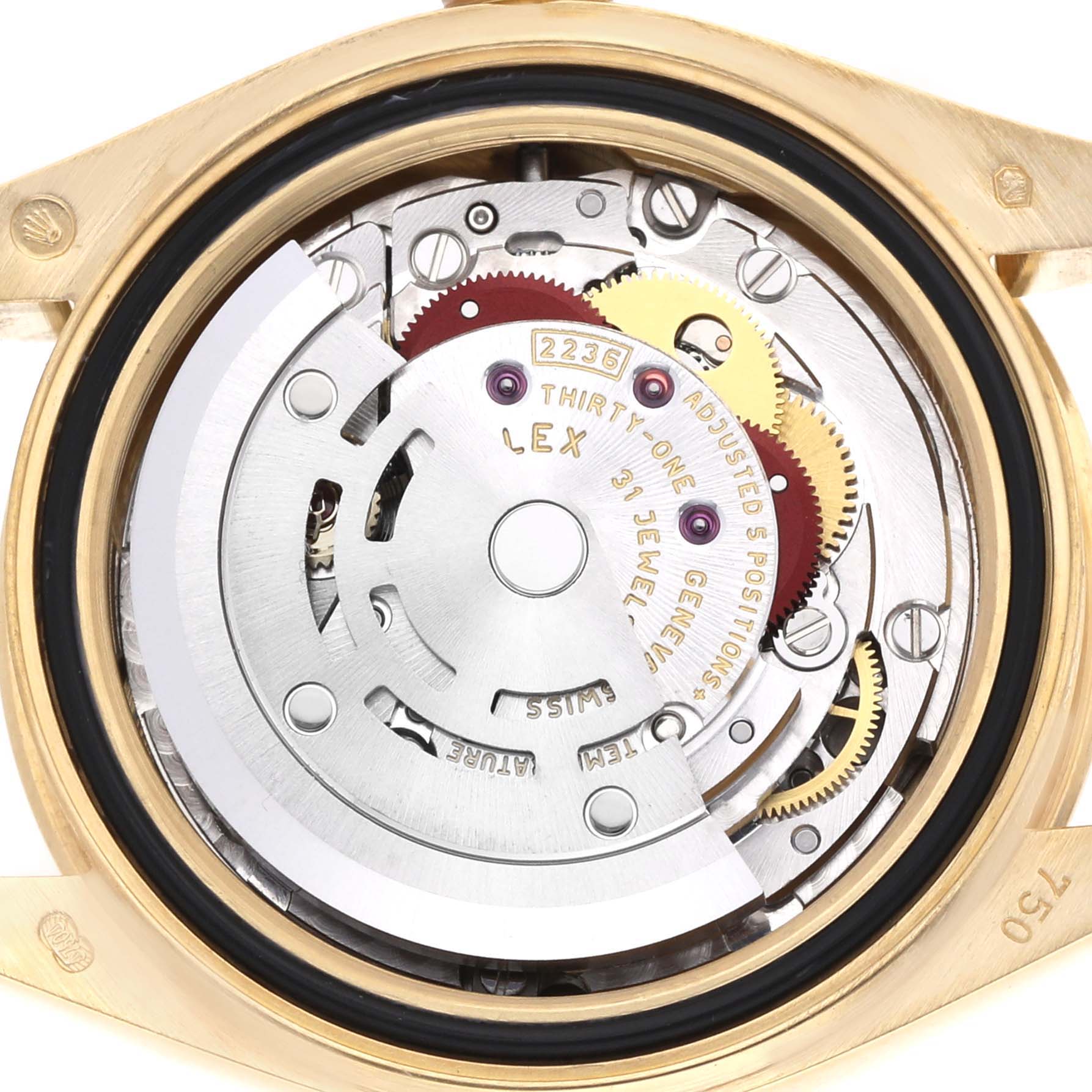 The image shows the Rolex President 279178 Women
s Yellow Gold Champagne Dial model
s watch movement, viewed from the back, highlighting gears and the rotor.
